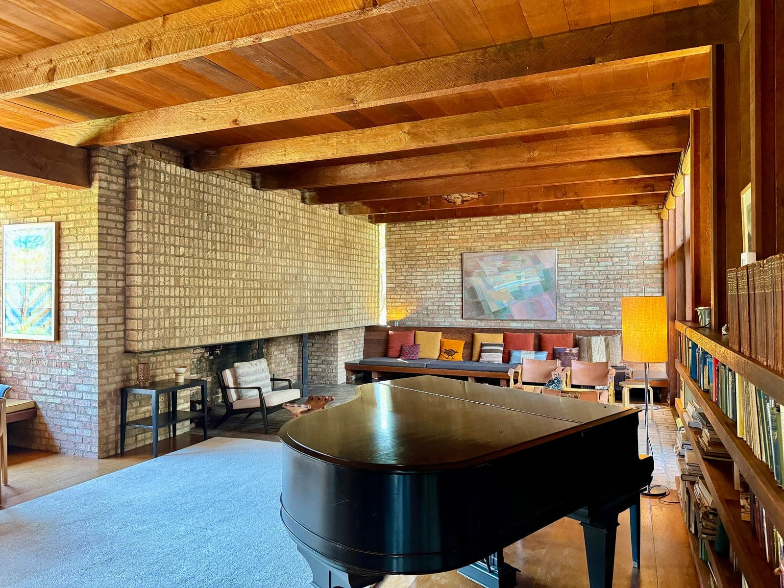 Remodeled lounge with velvet banquette seating — before